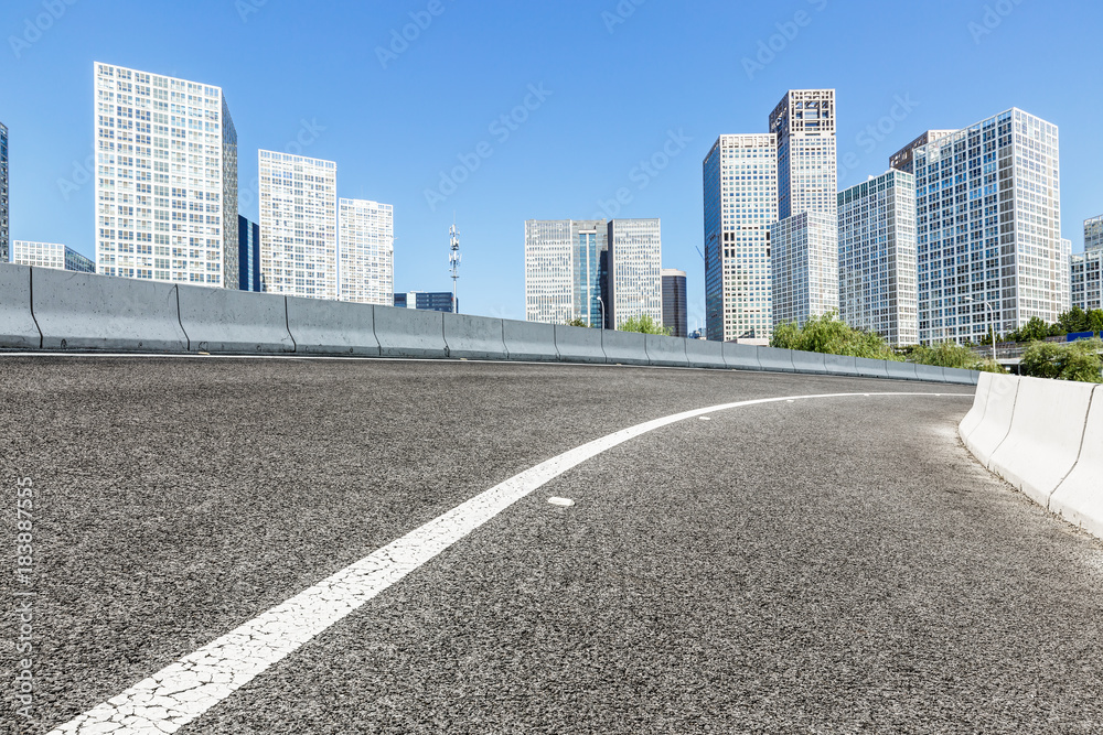 Asphalt road and modern city commercial buildings in Beijing,China