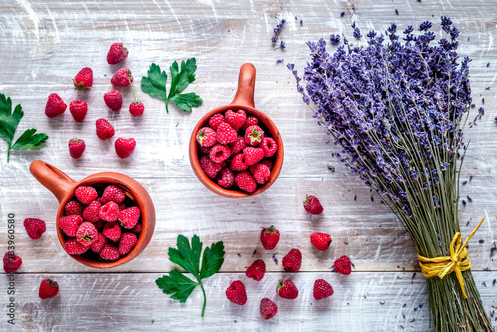 fresh raspberry and dry lavander in rustic design wooden backgro