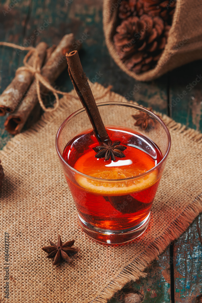 Christmas mulled wine on a rustic wooden table. Holidays concept.