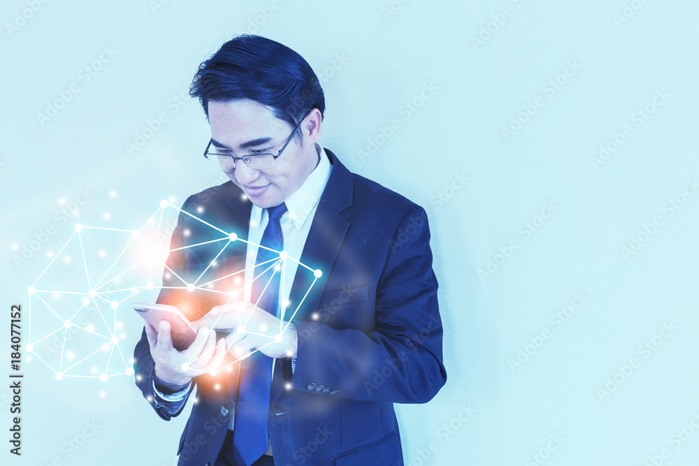 ASIAN GLASSES BUSINESSMAN IN SUIT USE SMARTPHONE WITH connecting ideas concept