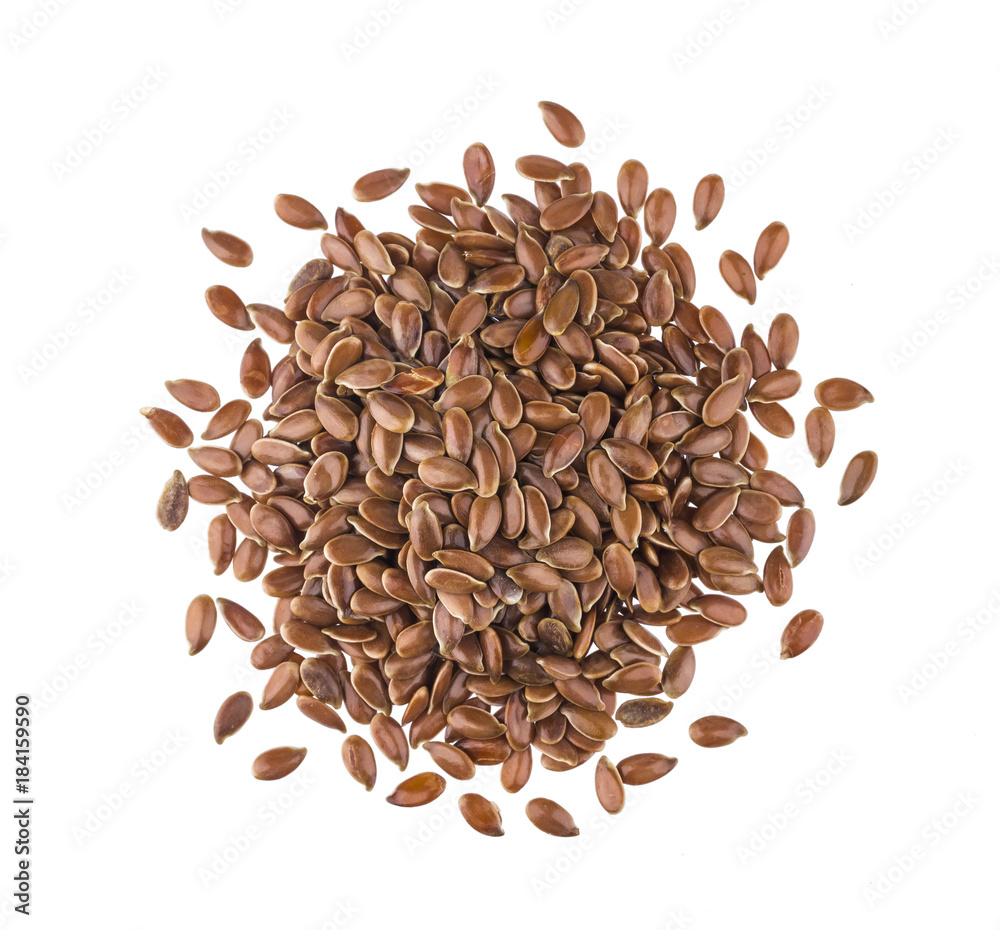 Pile of flax seeds isolated on white background close-up, top view