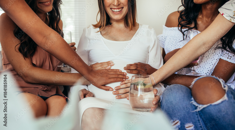 Friends sharing positivity and care for pregnancy