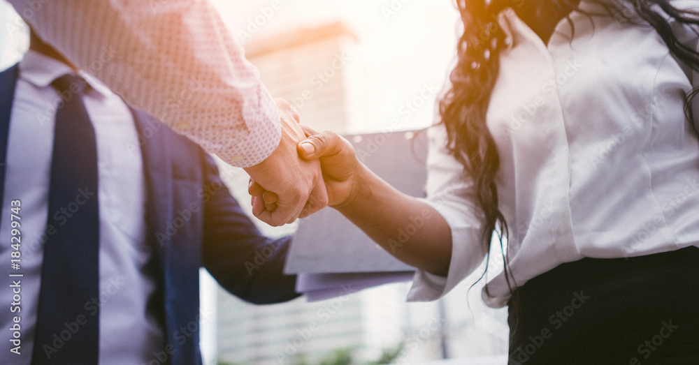 handshake of business People deal business. Hold hand and shaking hand in city