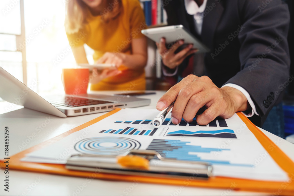 Working team meeting concept,businessman using smart phone and laptop and digital tablet computer in