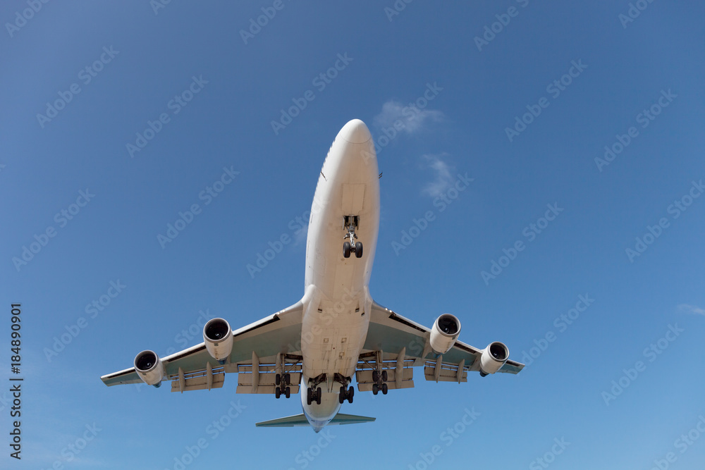 Passenger airplane in blue sky background.