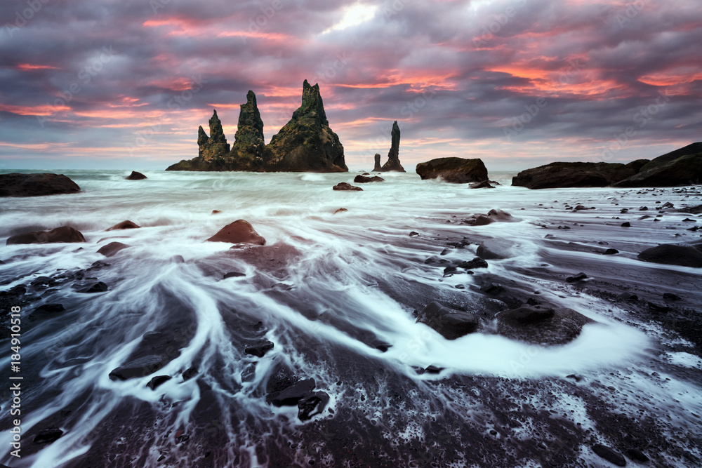 Basalt rock formations Troll toes on black beach. Reynisdrangar, Vik, Iceland