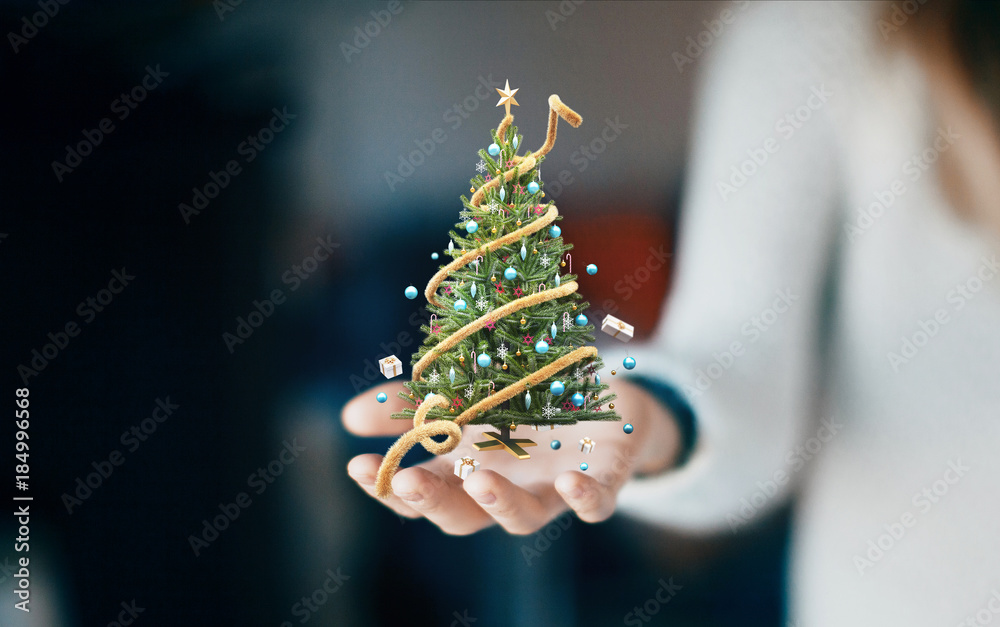 Albero di natale in mano, festività e auguri