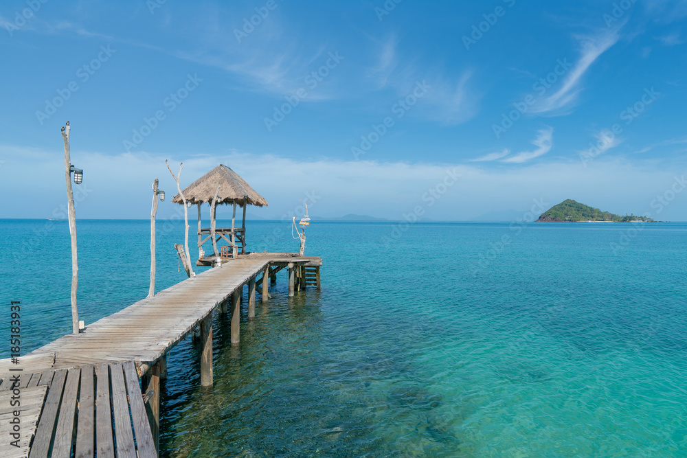 Wooden pier with boat in Phuket, Thailand. Summer, Travel, Vacation and Holiday concept.