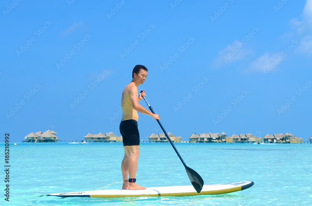 paddle board at maldives island