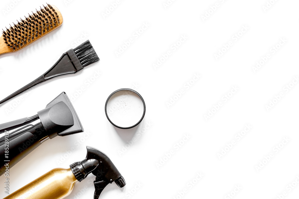 combs and hairdresser tools on white background top view