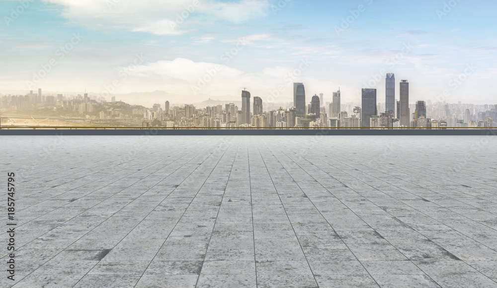 Road pavement and city skyline