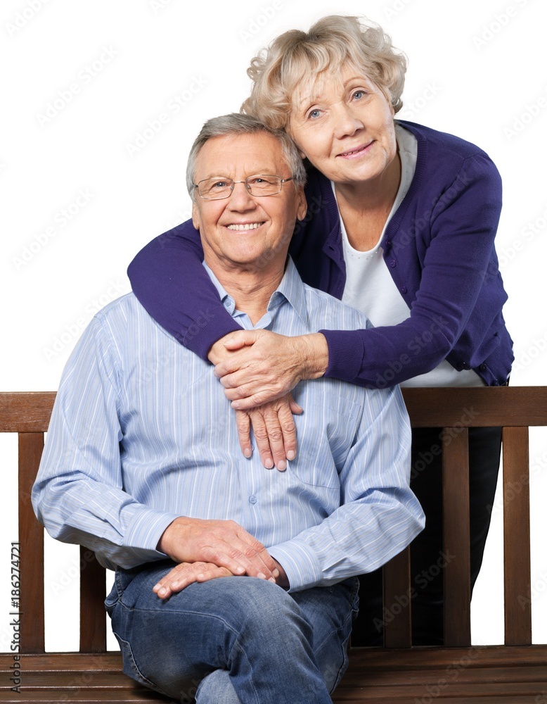 Portrait of a Mature Couple Embracing on the Bench