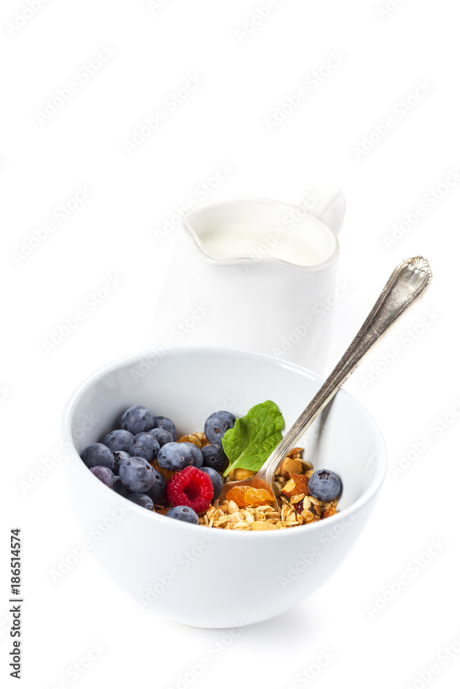 Granola with fresh organic raspberries and blueberries. Healthy breakfast