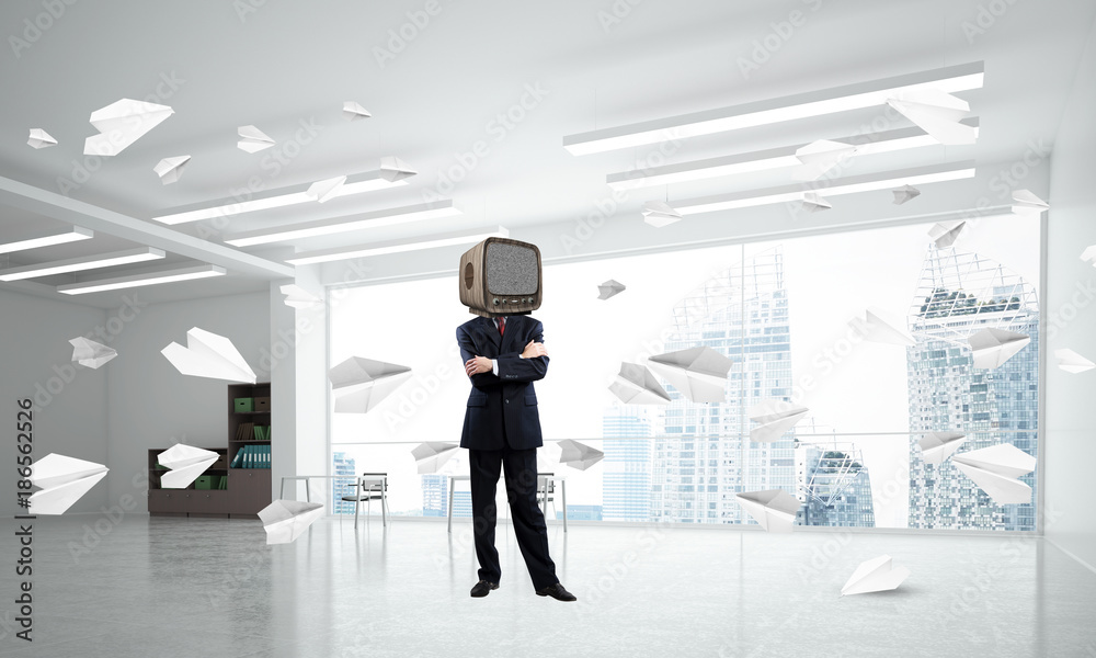 Businessman with an old TV instead of head.