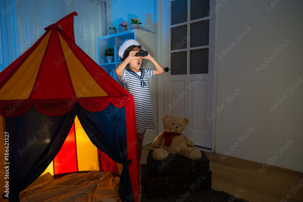 sailor girl trying adventure  and using binoculars