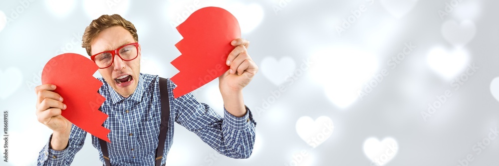 Valentines man breaking heart with love hearts background