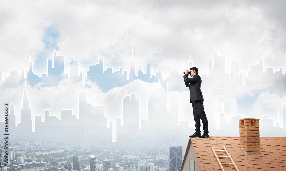 Businessman standing on roof and looking in binoculars. Mixed media