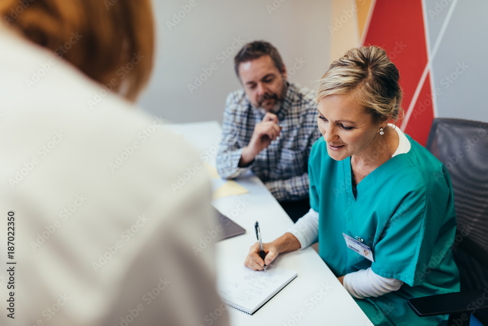 Healthcare team in boardroom at hospital