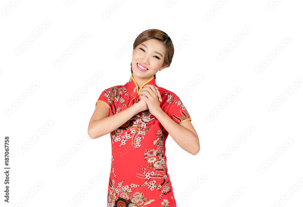 亚洲女人穿着中国传统的中国服装，在中国新年里表示祝贺