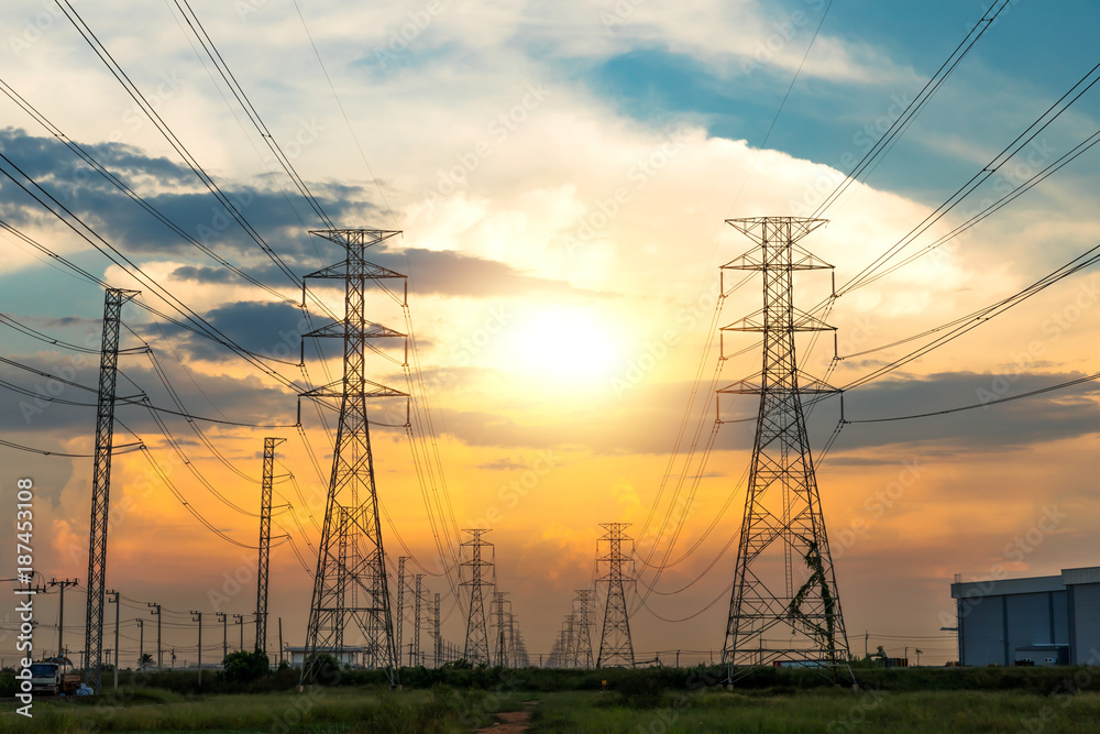 High voltage post.High-voltage tower sky with sun