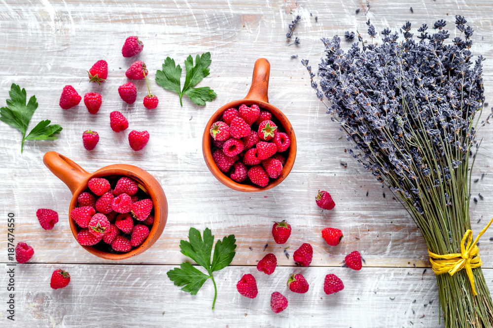 fresh raspberry and dry lavander in rustic design wooden backgro