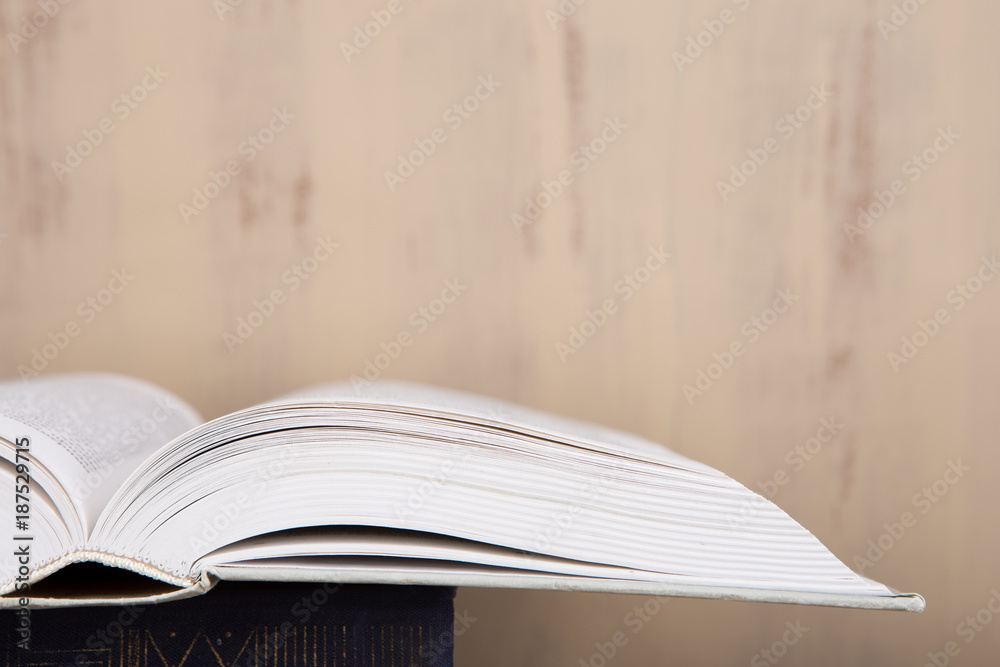 Education and reading concept - group of colorful books on the wooden table