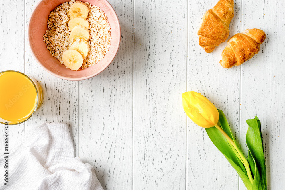 healthy breakfast with porridge on wooden background top view