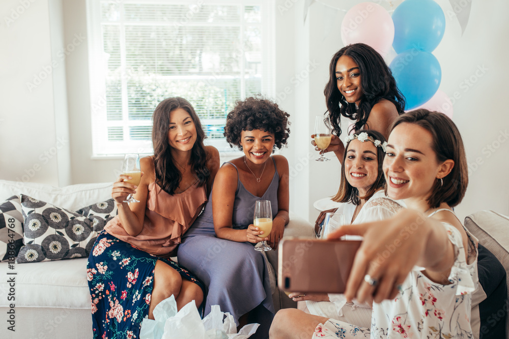 Women friends making selfie at baby shower