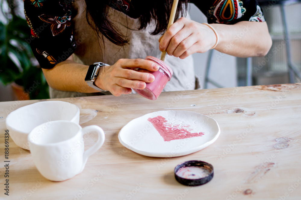 workshop production of ceramic tableware product painting