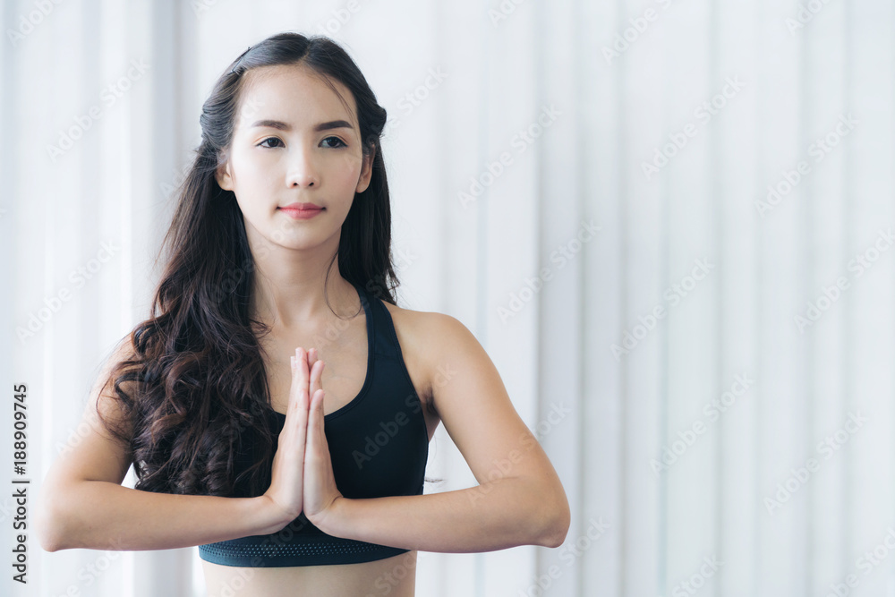 Woman practicing yoga pose in gym