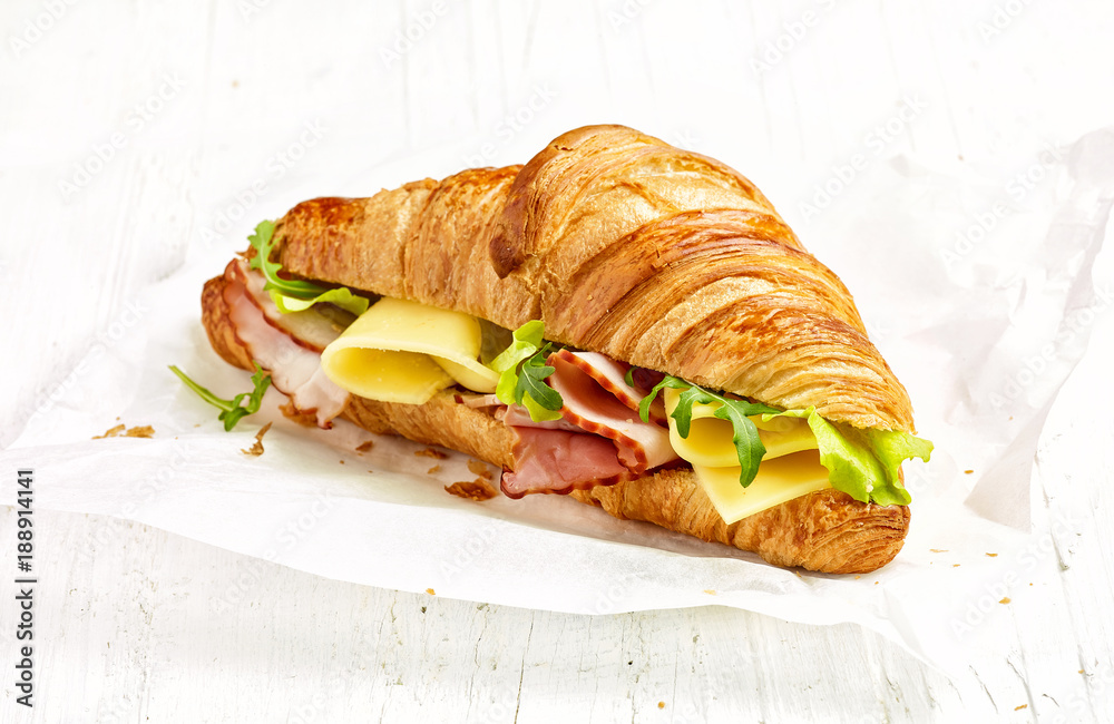 croissant sandwich with ham and cheese