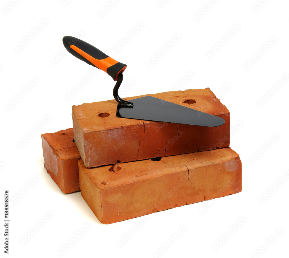 Brick and trowel on a white