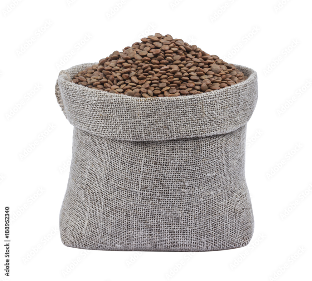 Lentils in burlap bag isolated on white background