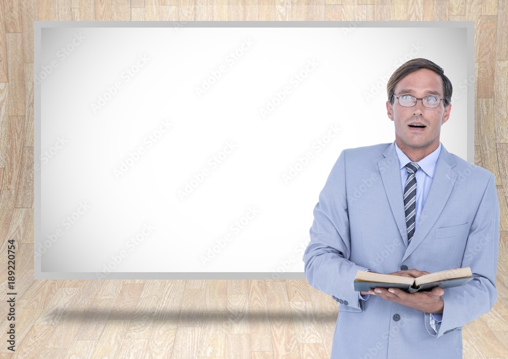 Businessman reading book with white board