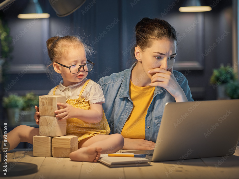 mother with toddler working