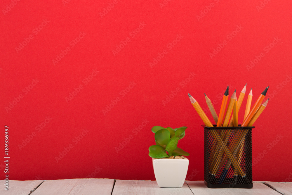 school supplies on red background, back to school concept