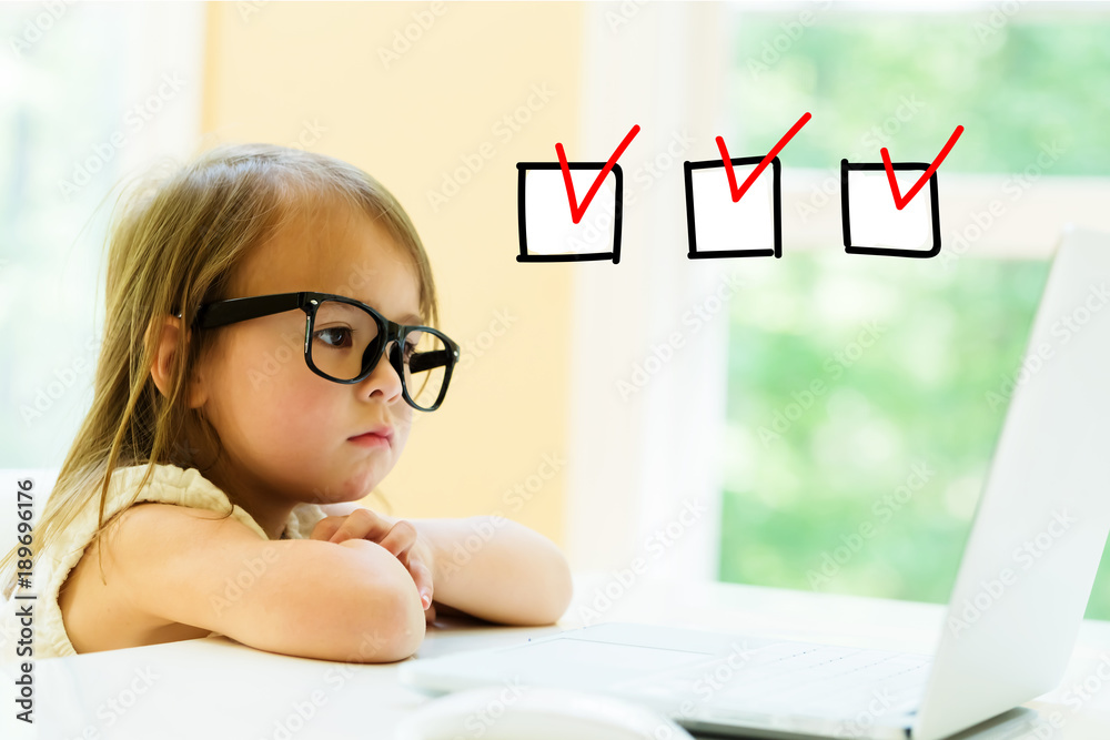 Checklist with little girl using her laptop