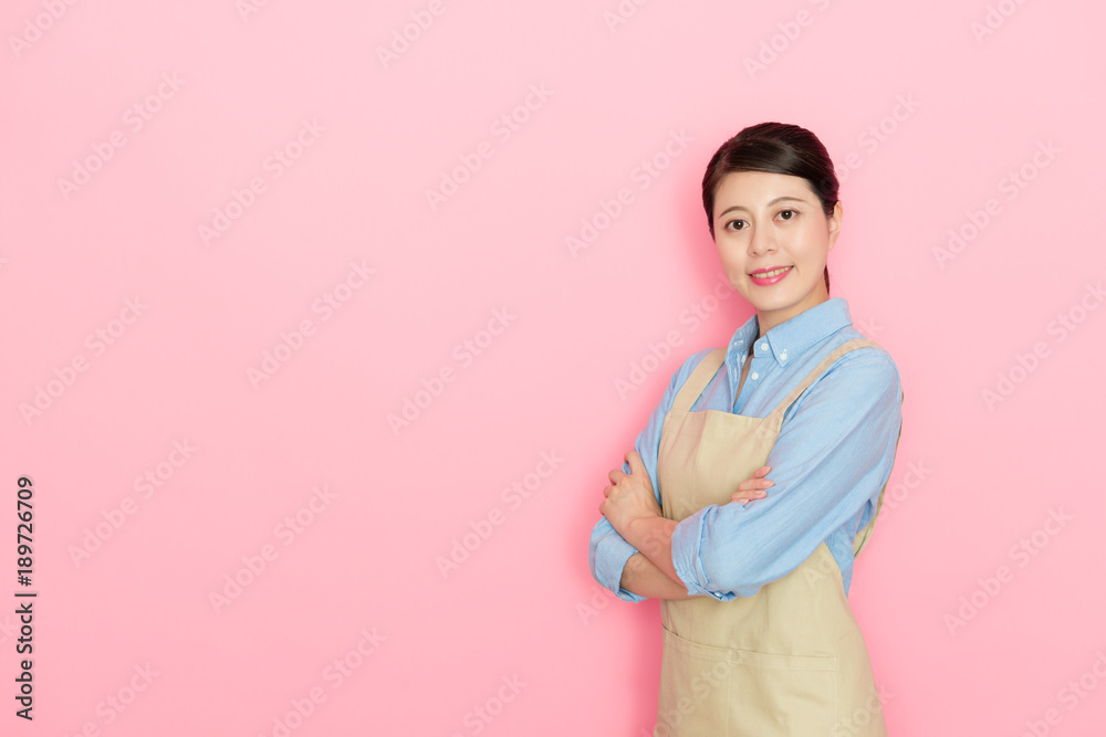 smiling housewife hands crossed looking at camera