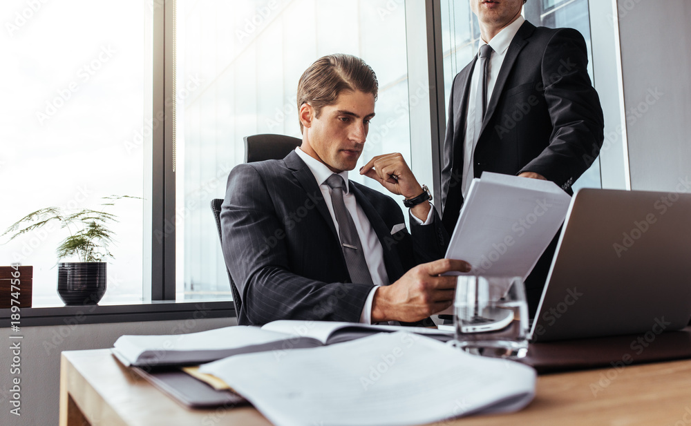 Businessman partners reading some paperwork