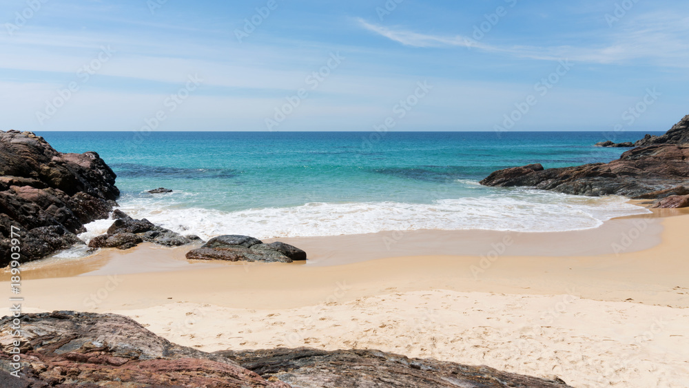 Beautiful scenery landscape of tropical sea and wave crashing on sandy shore in thailand.