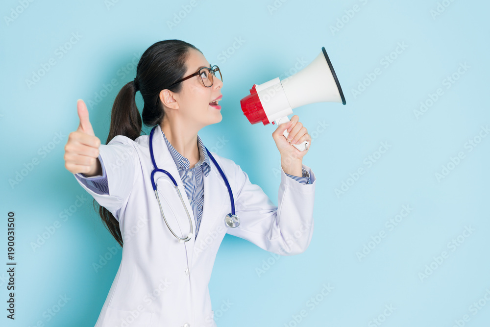 happy attractive woman doctor using loudspeaker