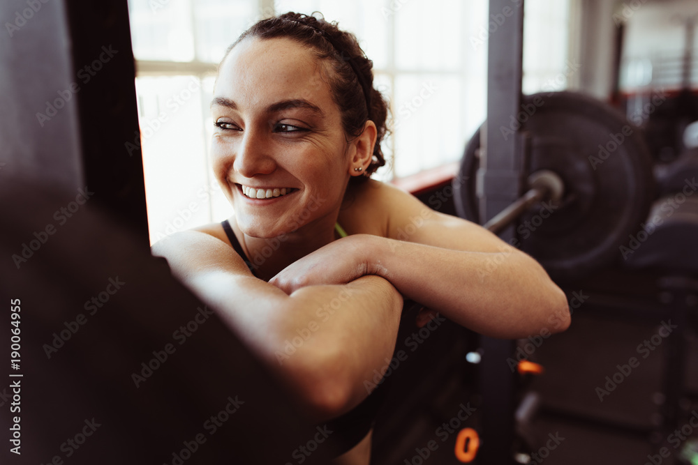 Female taking rest after intense training in gym