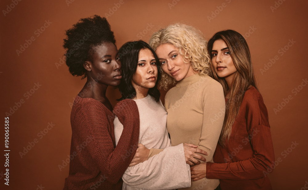 Group of beautiful female friends standing together