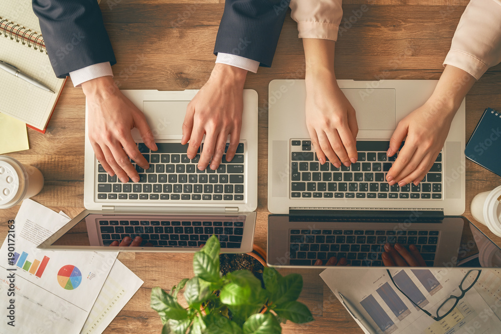 Man and woman working in office