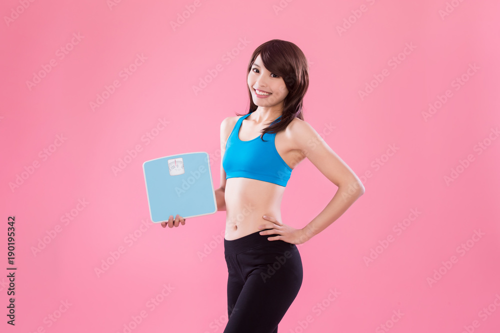 sport woman take weight scale