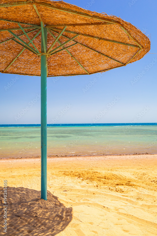 Parasol on the beach of Red Sea in Hurghada, Egypt