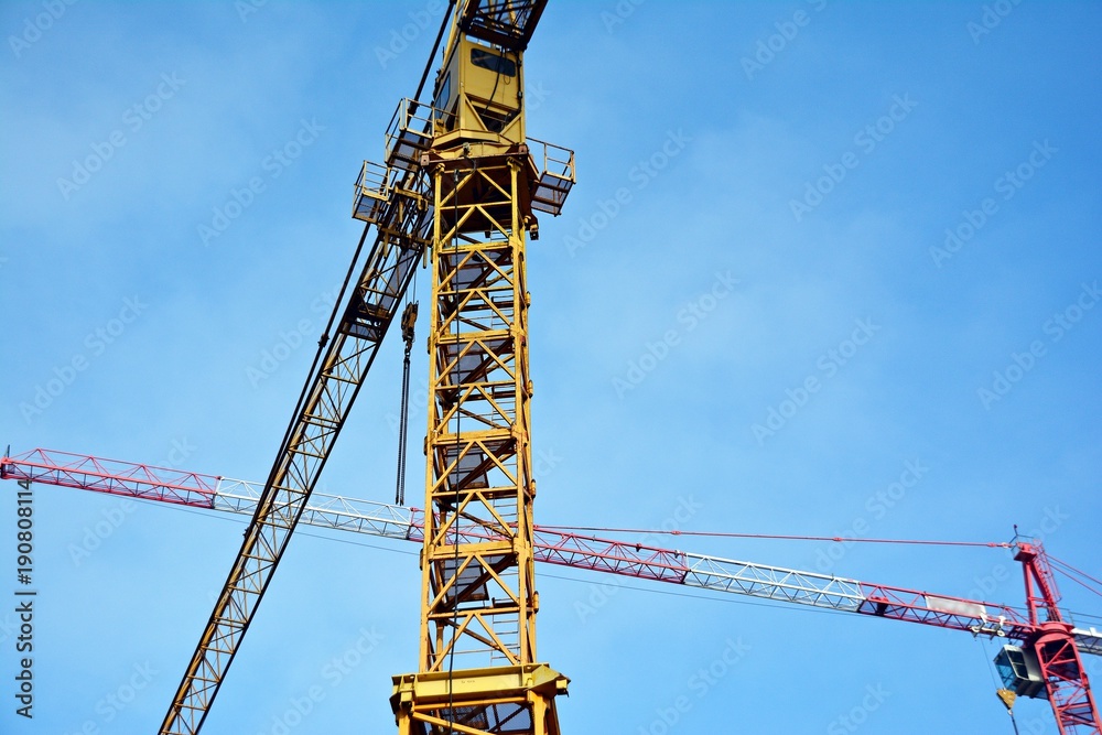 Construction of high-rise office center with modern technology. Fragment of a building on a light ba