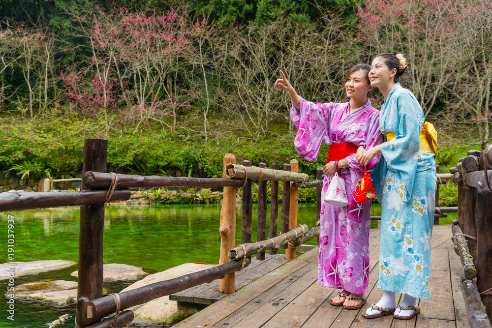 attractive pretty female travelers wearing kimono