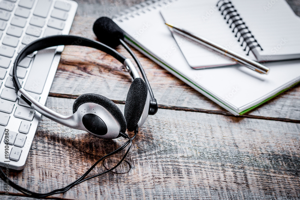 call center manager work desk with headset and keyboard