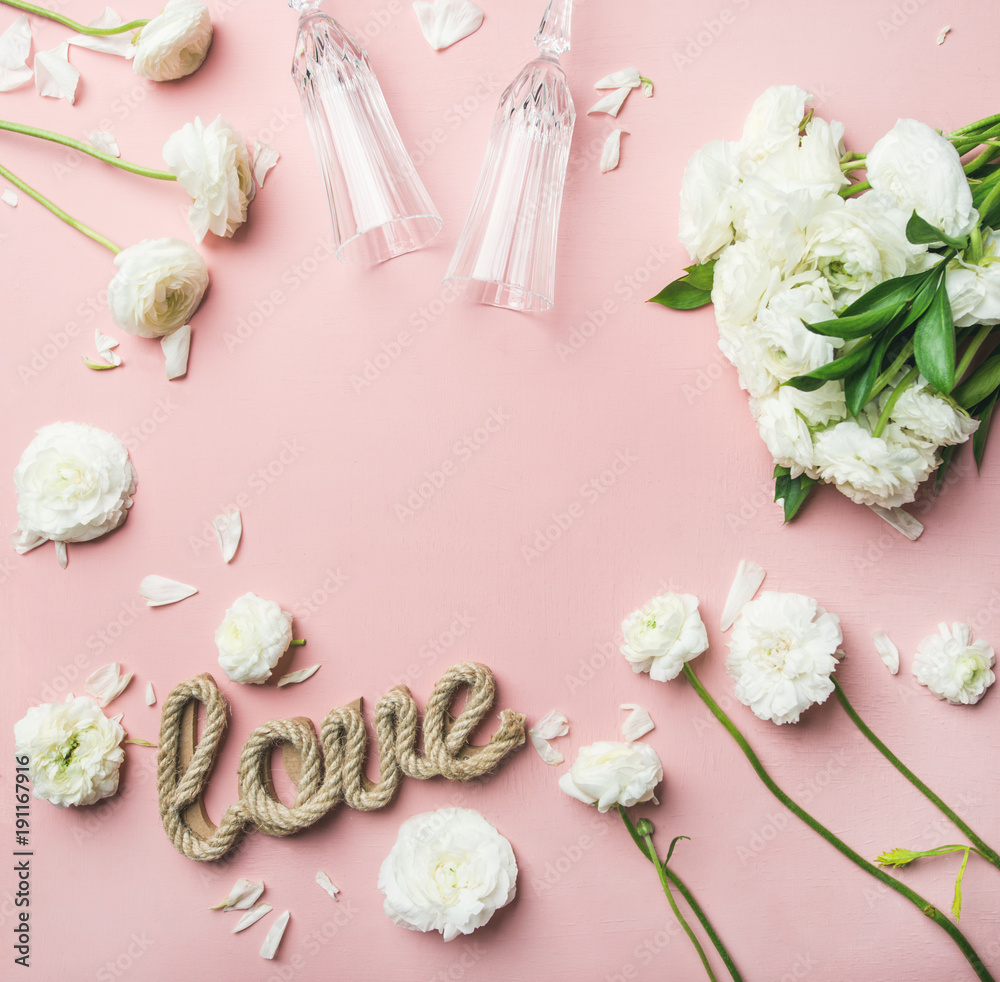 Saint Valentines Day frame and background. Flat-lay of white ranunculus flowers, champaign glasses a